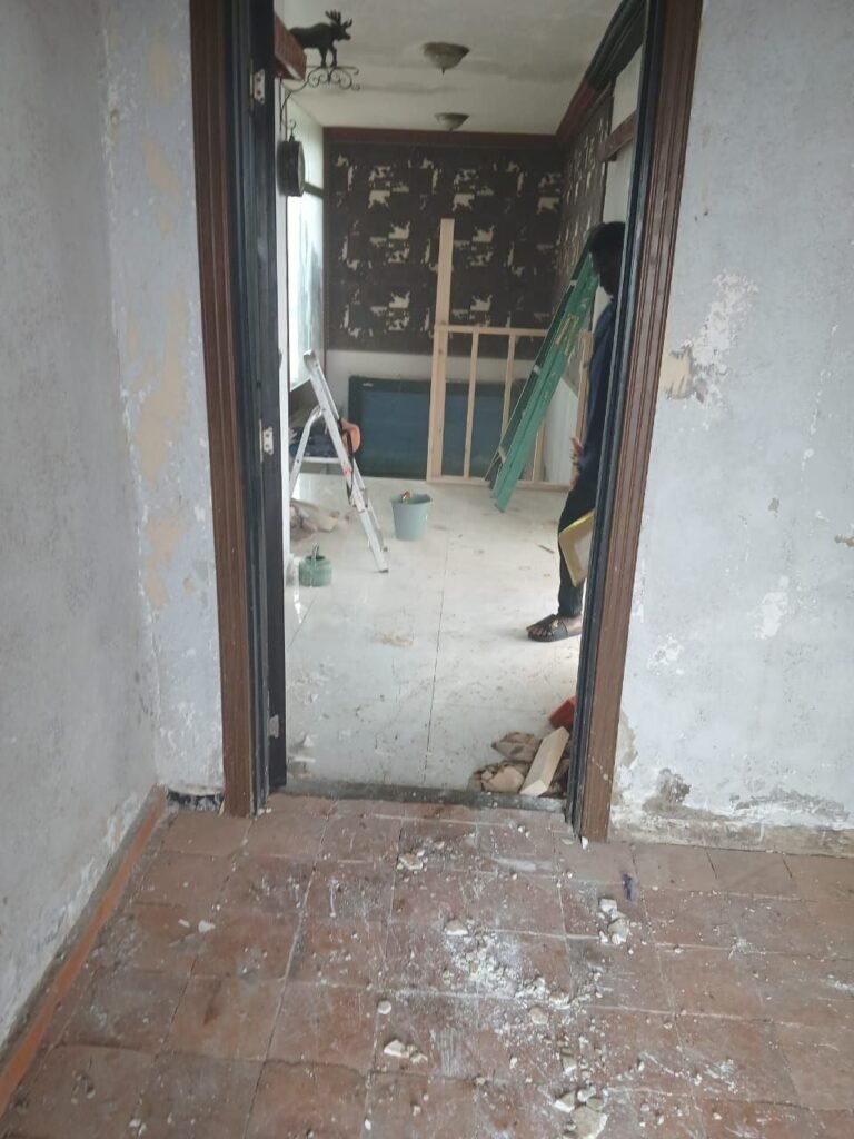 Room full of construction dust and debris before post-construction cleaning