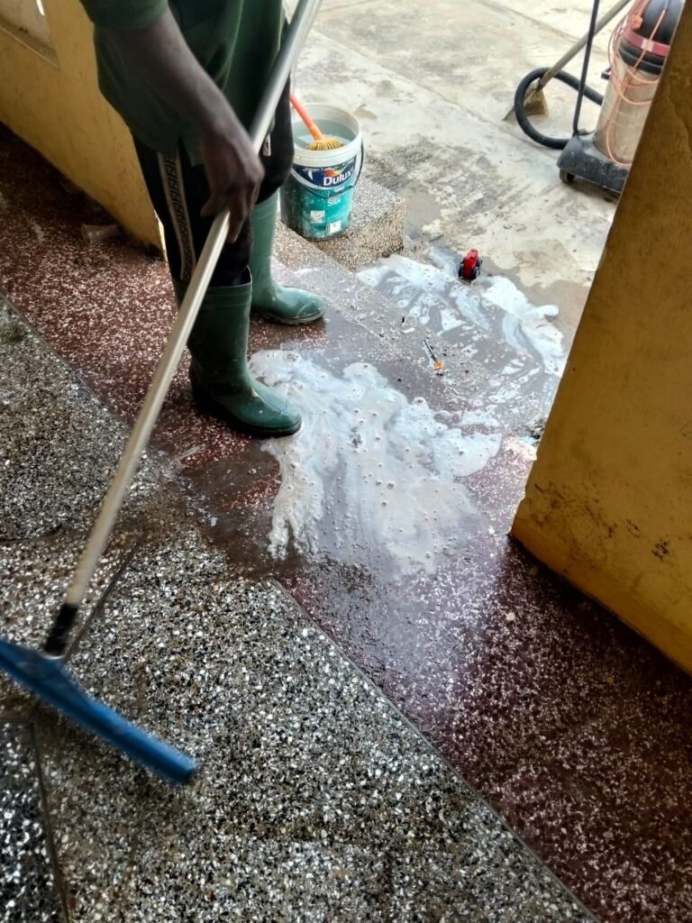 Dromo cleaner scrubbing a terrazzo floor with foam during floor restoration